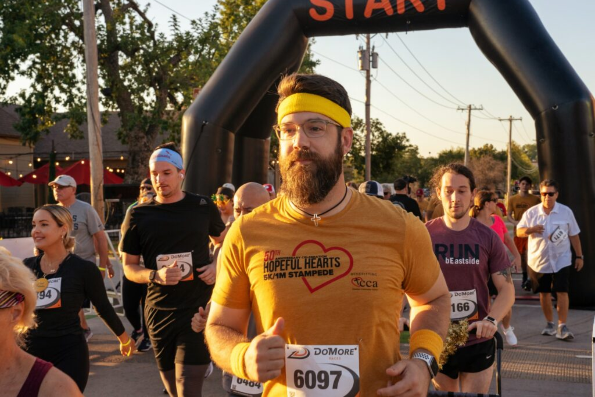 CCA Hopeful Hearts 5K/1M Stampede. People running in the race.